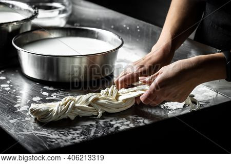 Production Process Of Mozzarella Cheese. Woman Working In A Small Family Creamery Is Processing The 