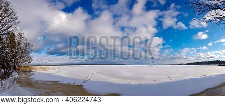 Panorama Of A Snowy Lake With Footprints In The Snow In Riga, Latvia