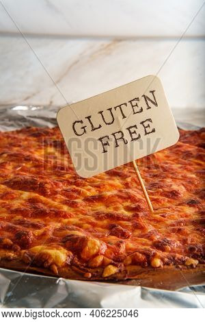 Unsliced Crispy Nyc Style Pizza Pie On Tin Foil