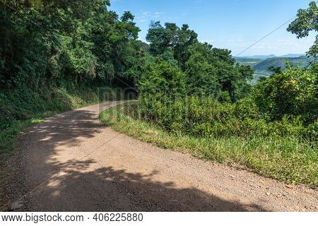 Dirty Road With Forest And Valley