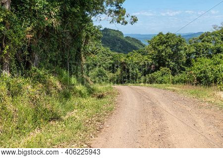 Dirty Road With Forest And Valley
