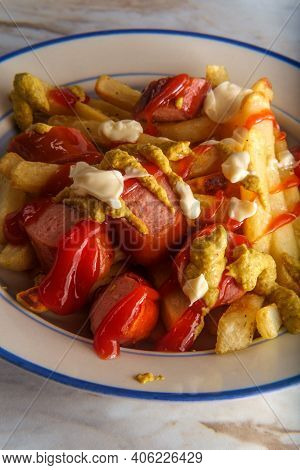 Peruvian Fast-food Salchipapas French Fries And Sliced Sausage