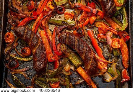 Broiled Sausage Onions And Peppers With Cherry Tomatoes And Thyme