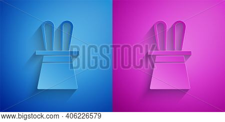 Paper Cut Magician Hat And Rabbit Ears Icon Isolated On Blue And Purple Background. Magic Trick. Mys