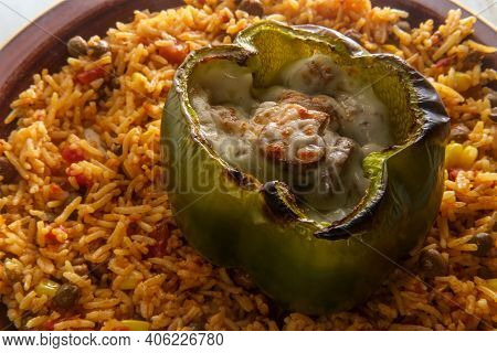 Cheesesteak Stuffed Bell Pepper With Spicy Spanish Pigeon Pea Corn Rice