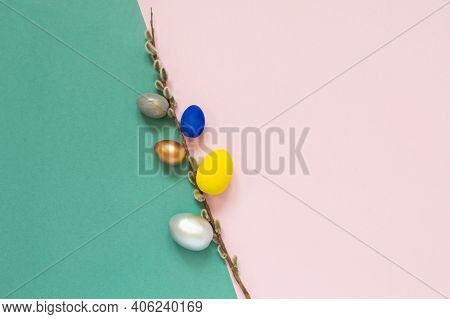 Colored Easter Eggs With Willow Branch On Color Pink And Green Background. Congratulatory Easter Bac