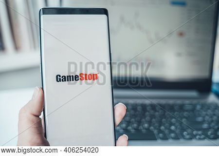 Russia Moscow 02.02.21 Mobile Phone With Logo Of Gamestop In Hand. Company Making Video Games. Playi