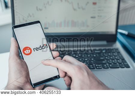 Russia Moscow 02.02.21 Mobile Phone With Logo Of Reddit Traders In Hand. Community Of Financiers Pum