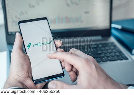 Russia Moscow 02.02.21 Mobile Phone With Logo Of Broker Robinhood In Hand.financial Company For Trad