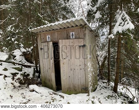 Country Toilet In The Winter Outdoors. Outdoor Toilet Construction. Cabin - Toilet In The Forest On