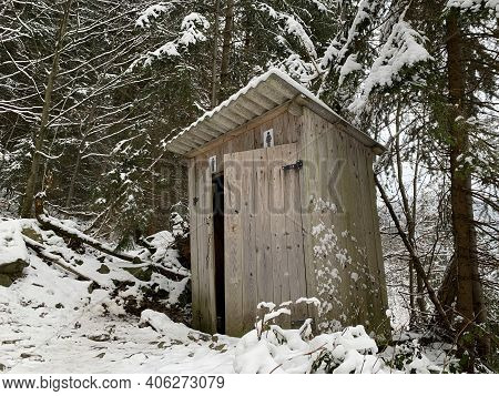 Country Toilet In The Winter Outdoors. Outdoor Toilet Construction. Cabin - Toilet In The Forest On