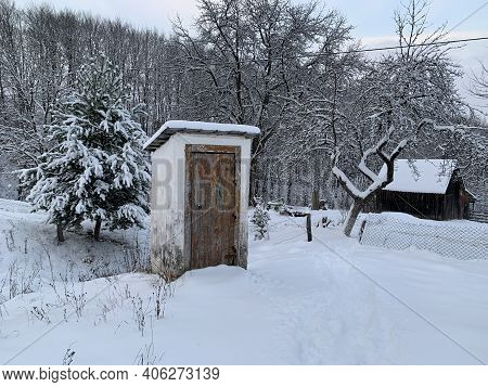 Country Toilet In The Winter Outdoors. Outdoor Toilet Construction. Cabin - Toilet In The Forest On
