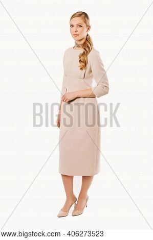 Full Legth Portrait Of Elegant Young Woman Wearing Bodycon Beige Dress And High Heel Patent Court Sh