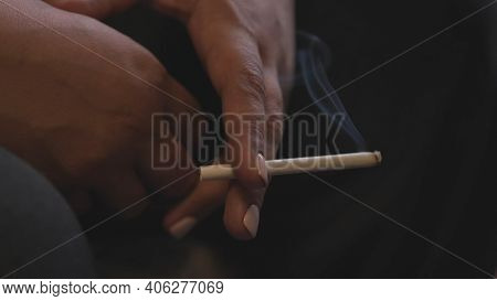 Close Up Of Hand Of Fifty Year Old Woman Smoking A Cigarette. Stock Footage. Hands Of Senior Woman W