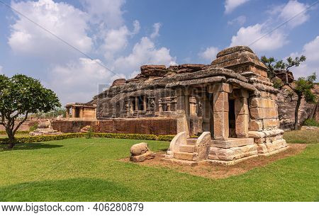 Aihole, Karnataka, India - November 7, 2013: Ravanaphadi Cave Shiva Temple. Black Rock With Brown St