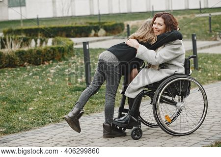 Mother In A Wheelchair With Hre Daughter