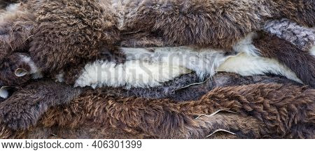 Layers Of Animal Pelts In Various Shades From White To Brown