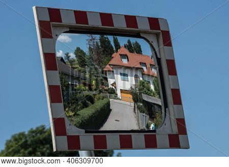 Single Family Detached Home Building In A Mirror