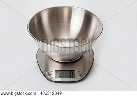 Scales Kitchen Desktop Metal Electronic With A Metal Bowl. Background For Household Appliances.