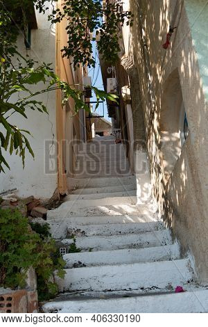 Small Street With Sea Background And Green Plant. Dreamy With Little Balconys