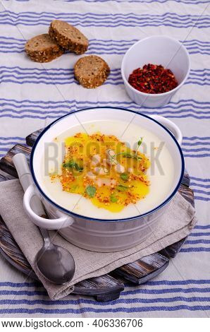 Vegetable Cream Soup With Beans And Spicy Oil In A Bowl On A Textile Background. Selective Focus.