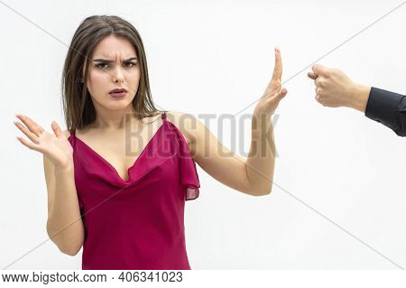 Negative Human Emotions And Feelings. Lovely Female Frowning To The Zilch Sign Her Man Shows Her Say