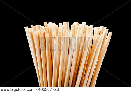Close Up Wheat Straw For Drinking Water On Black Background. Zero Waste Concept.