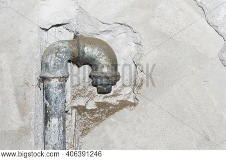 Metal Water Pipe. Old House Plumbing System Background. Grunge Rusty Steel Pipe. Iron Piping In The 
