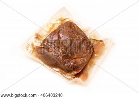 The Semifinished Pulled Pork Meat In The Plastic Foil Prepared By The Sous Vide Process Isolated On 
