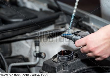 Automotive Technology - Female Mechanic In An Auto Repair Shop At A Car Service, Close-up