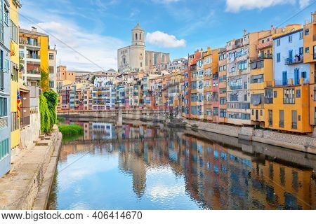 Girona, Spain. View Of Cathedral And Colorful Houses  Reflecting In Onyar River