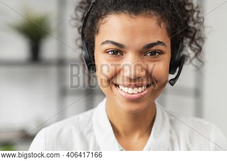 Headshot Of Friendly African American Millennial Woman In Headset, Smiling And Working In Emergency 