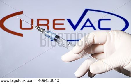 Madrid, Spain- February 3, 2020: Hand On White Surgery Glove Holding Syringe With Covid Vaccine. In 