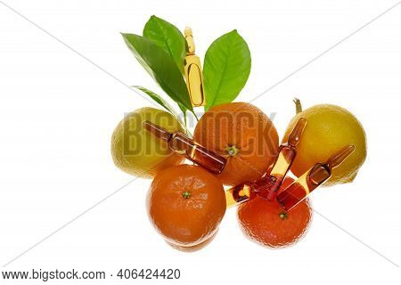 Vitamin C Injection.a Solution Of Vitamin C In Brown Glass Ampoules Set And Citrus Fruit Isolated On
