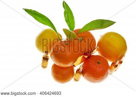 Vitamin C .a Solution Of Vitamin C In Brown Glass Ampoules Set And Citrus Fruit Isolated On White Ba