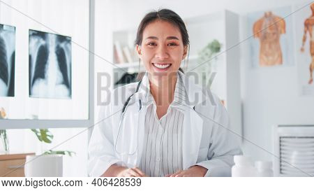 Portrait Of Asian Female Doctor Smiling, Look At Camera, Online Video Call Remote Meeting. Healthcar