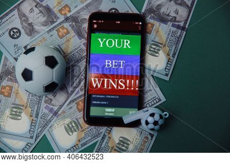 Ball, Whistle And Smartphone With Bet Application On Cash And Green Background. Gambling And Bet Con