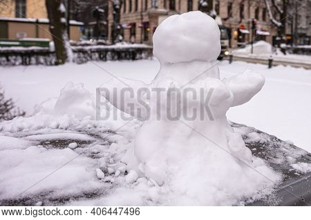 Snowman, Snow Woman Molded From Snow. Snowy Winter Concept. High Quality Photo
