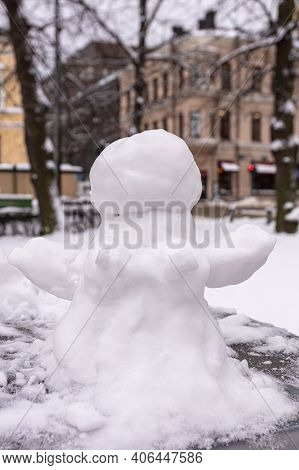 Snowman, Snow Woman Molded From Snow. Snowy Winter Concept. High Quality Photo
