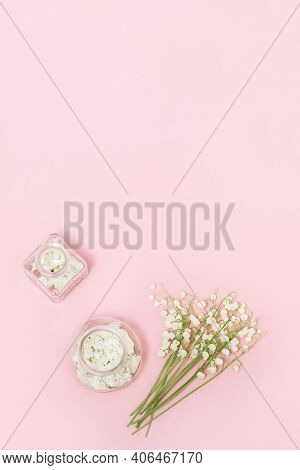 Small First Spring Flowers Lilies Of The Valley And Beautiful Glass Bottle With Dried Petals For Aro