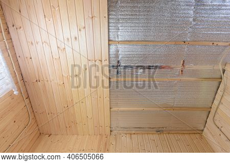 Partially Finished Ceiling With Clapboard In The Room Of A Wooden House