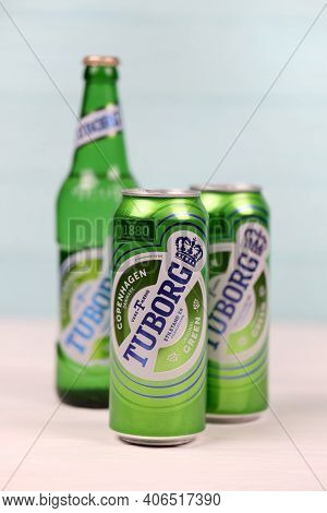 Kharkov, Ukraine - December 8, 2020: Aluminium Cans Of Green Tuborg Beer On Wooden Background. Tubor