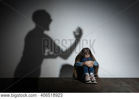 Domestic Violence, Abusing. Scared Little Caucasian Girl, Victim Sitting Close To White Wall With Sh