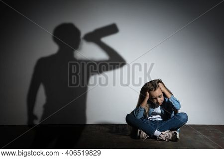 Domestic Physical Violence, Abusing. Scared Little Caucasian Girl, Victim Sitting Close To White Wal