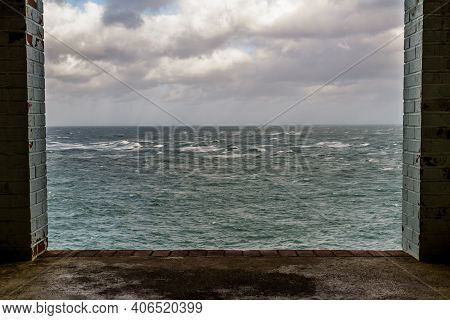 Window Frame In Derelict Building Looking Out To Stormy Sea