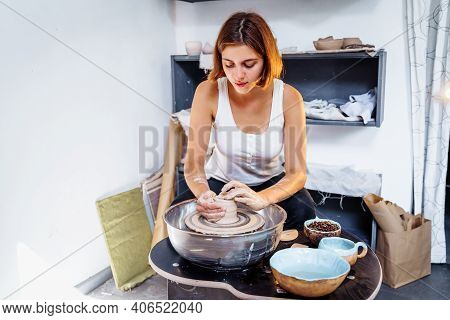 Painstaking Work Of A Professional Charming Female Potter Enjoying Art Of Pottery And Manufacturing