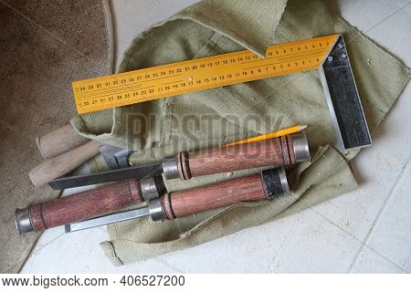 Carpentry Tools For Woodworking: Set Of Chisels For Wood, Square Tool And Pencil.