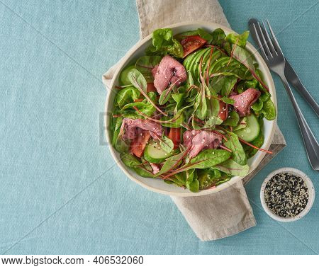 Keto Salad With Roast Beef Meat Sous Vide, Tomatoes, Cucumbers, Avocado On Pastel Linen Tablecloth. 