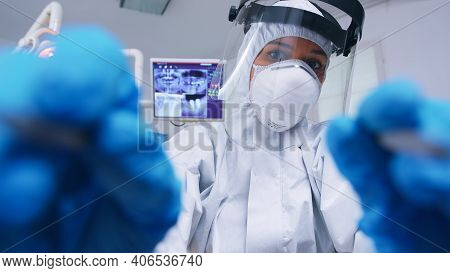 Pov Of Dentist In Ppe Suit Against Covid Working On Patient Mouth Hygine In Dental Office With New N