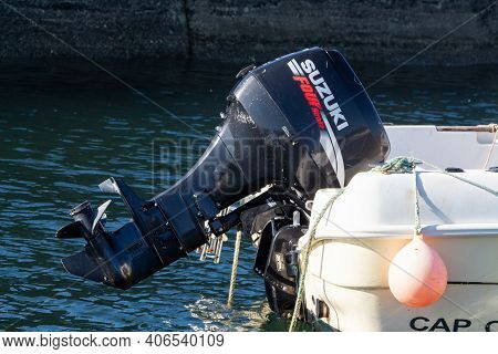 Primelin - France, October 04, 2018 : Suzuki Motor Of A Boat In Primelin Harbor